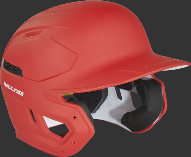 Right angle view of a CAR07A Rawlings MACH Carbon helmet with a matte scarlet shell