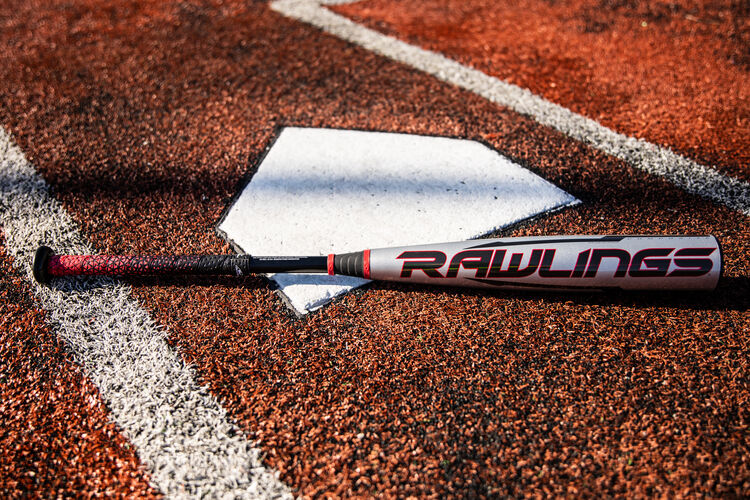 A Rawlings USA -8 Quatro Pro baseball bat on a field next to home plate with a black Rawlings logo - SKU: US1Q8