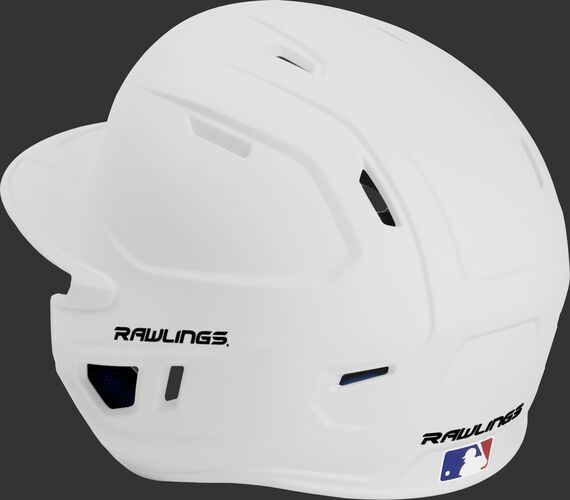 Back left view of a matte white MACHEXTL MACH series batting helmet with air vents