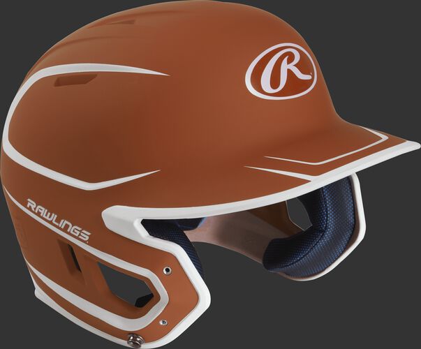 Right angle view of a matte MACH Junior batting helmet with an orange/white shell