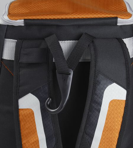 Exterior handle on the back of a black/orange R500 backpack with a hook for hanging it up