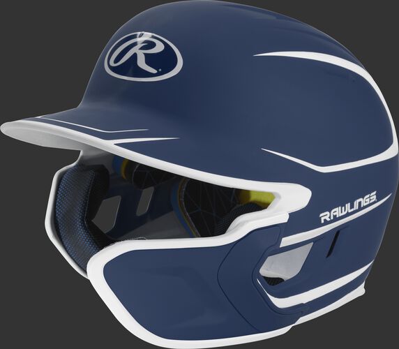 Left angle view of a matte navy/white MACHEXTR Mach junior helmet with Mach EXT right hand batter face guard extension