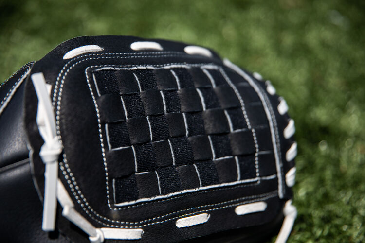 Black Basket web of a RSB recreational glove with a field in the background - SKU: RSB140GB