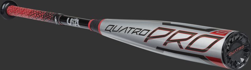Angled view of a USA Quatro Pro baseball bat with a gray barrel, red accents and black end cap - SKU: US1Q8