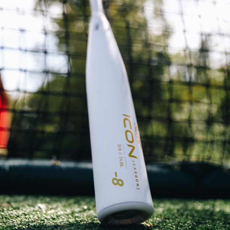 White barrel of a 2024 Icon USSSA baseball bat in a batting cage - SKU: RUT4I