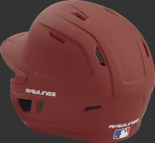 Back left view of a matte cardinal MACH series batting helmet with air vents