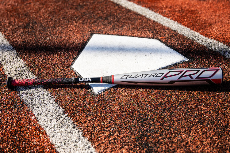 A gray USA -8 Quatro Pro on a field next to home plate - SKU: US1Q8