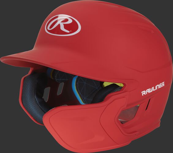 Left angle view of a matte scarlet MACHEXTR Mach Senior helmet with Mach EXT right hand batter face guard extension