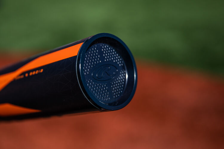 End cap of a Rawlings Impact baseball bat with a field in the background - SKU: BBZI3