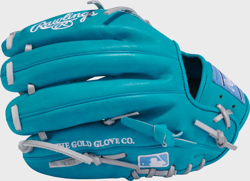 Back of a teal Rawlings Heart of the Hide 11.75-Inch Infield/Pitcher's Glove with the MLB logo on the pinky