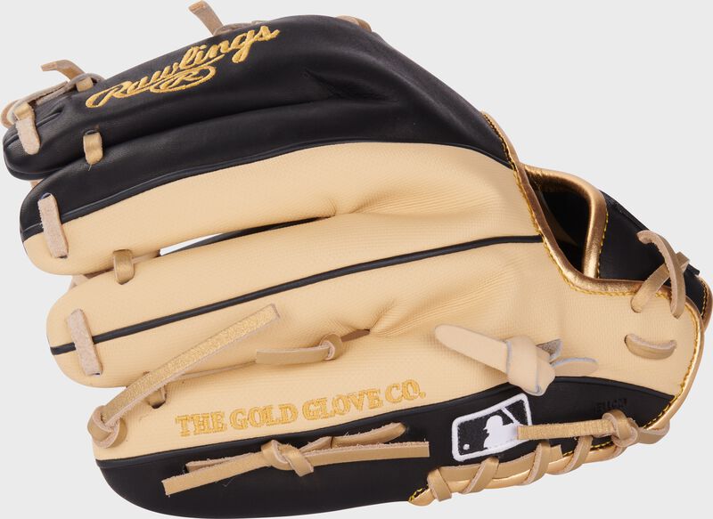 Camel/black back of a Rawlings Heart of the Hide ContoUR fit infield glove with the MLB logo on the pinky