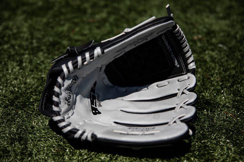 Grey palm of a RSB recreational softball glove lying on a field - SKU: RSB125GB