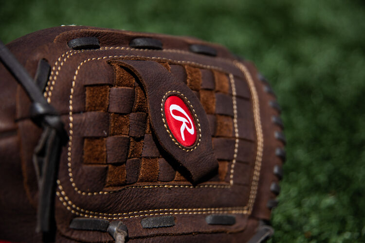 Brown Basket Web on a Rawlings Player Preferred recreational glove lying on a field - SKU: P140BPS