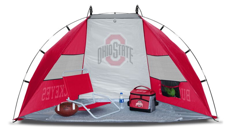 An Ohio State Buckeyes sideline sun shelter set up with a chair, cooler, football and water bottle - SKU: A New England Patriots sun shelter set up on a beach with a chair, football, cooler and water bottle - SKU: 00973042111