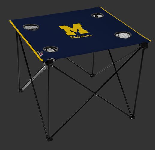 A navy NCAA Michigan Wolverines deluxe tailgate table with four cup holders and team logo printed in the middle SKU #00713083111