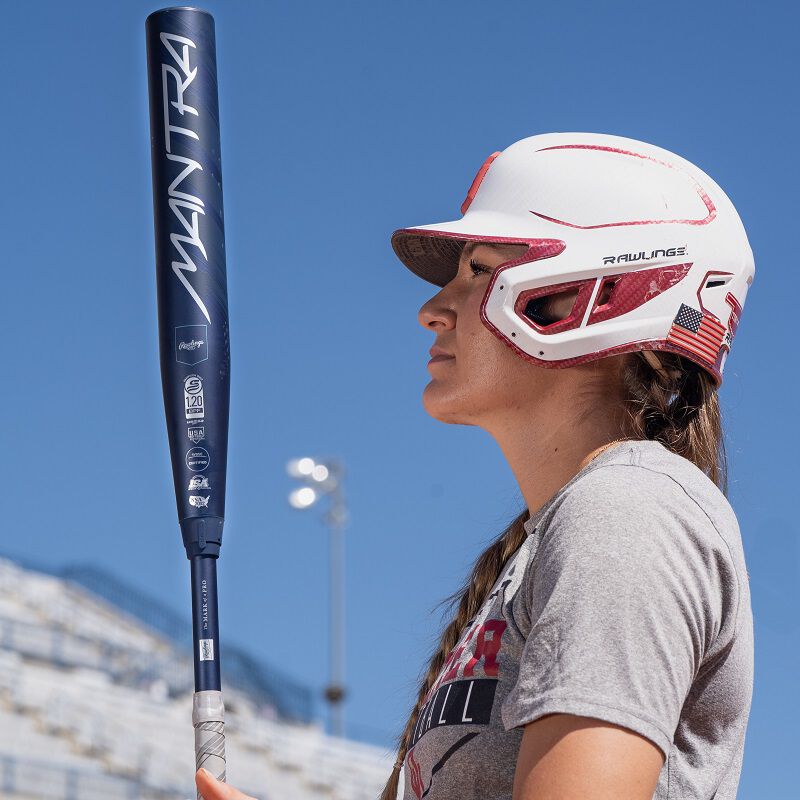 A picture of Kinzie Hansen holding a 2025 Mantra bat and looking at the barrel