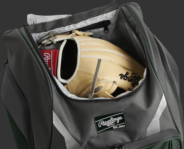 A glove in the dedicated glove storage pocket of a Rawlings Legion equipment backpack - SKU: LEGION-DG