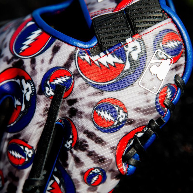 Pictuer of the back pinky with the MLB logo on a Rawlings Grateful Dead REV1X glove