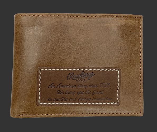A tan American Story bi-fold wallet with a leather patch on it telling the Rawlings American story - SKU: RPW001-204