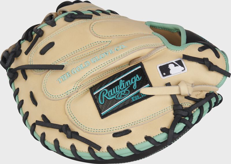 Back of a camel Heart of the Hide catcher's mitt with a black/mint Rawlings patch - SKU: PROCM33CBM