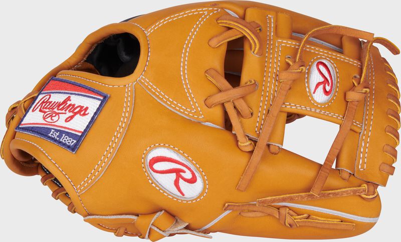 Thumb of a tan/navy 11.5" Heart of the Hide infield glove with a tan I-web