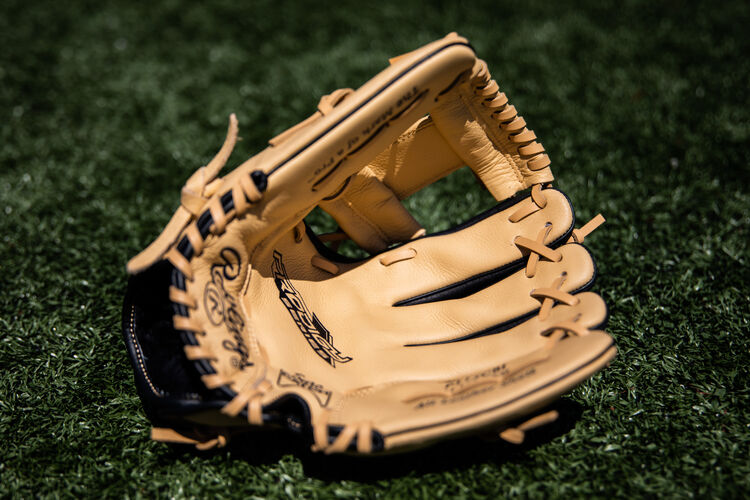 Camel palm of a Prodigy I-web infield glove lying on a field - SKU: P115CBI