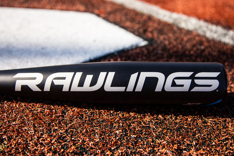 A blue 5150 logo on the barrel of a USA Baseball 5150 bat next to home plate - SKU: US155
