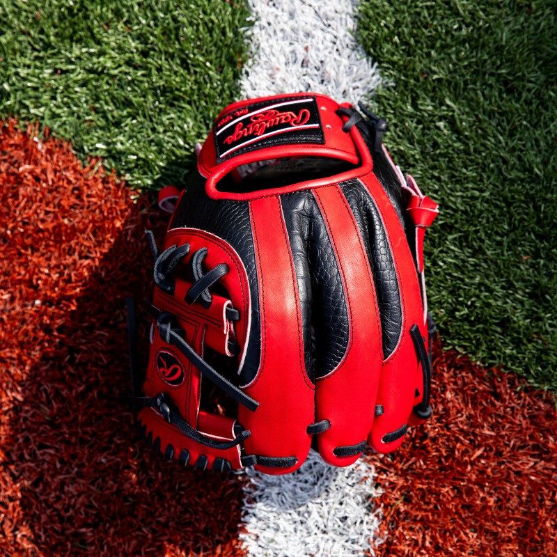 Birds-eye view of a scarlet/black HOH ColorSync 8.0 infield glove on a field