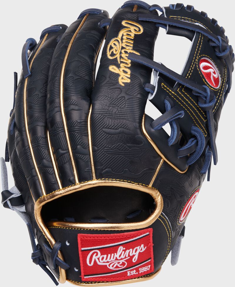 Back of a navy Anthony Volpe Heart of the Hide Infield Glove with a red Rawlings patch