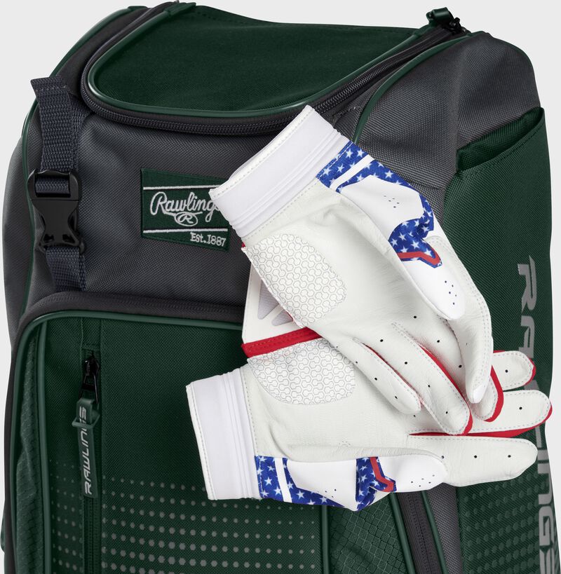 Two batting gloves hanging on the front Velcro strap of a Franchise baseball backpack - SKU: FRANBP-DG