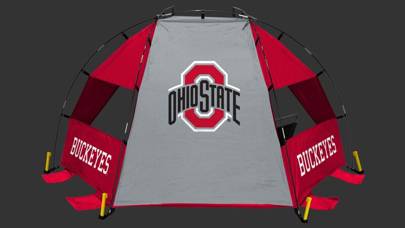 An Ohio State Buckeyes sun shelter set up on a beach with a cooler, football, chair and water bottle - SKU: 00973042111