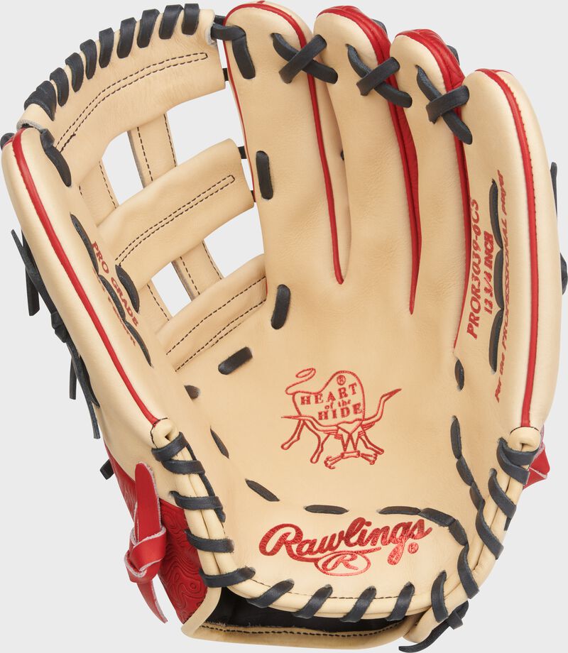 Camel palm of a Rawlings Heart of the Hide 12.75-Inch Outfield Glove with scarlet stamping and black laces