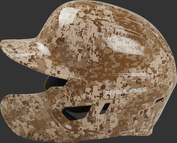 Left side of a MACHEXTR-DCMO Rawlings Mach EXT batting helmet with an MEXT face guard extension attached