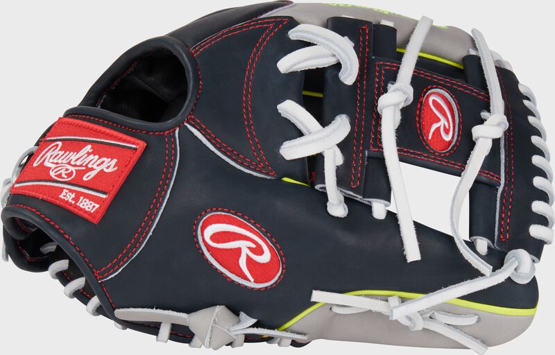 Thumb of a navy/gray Xander Bogaerts Heart of the Hide infield glove with a Pro I web