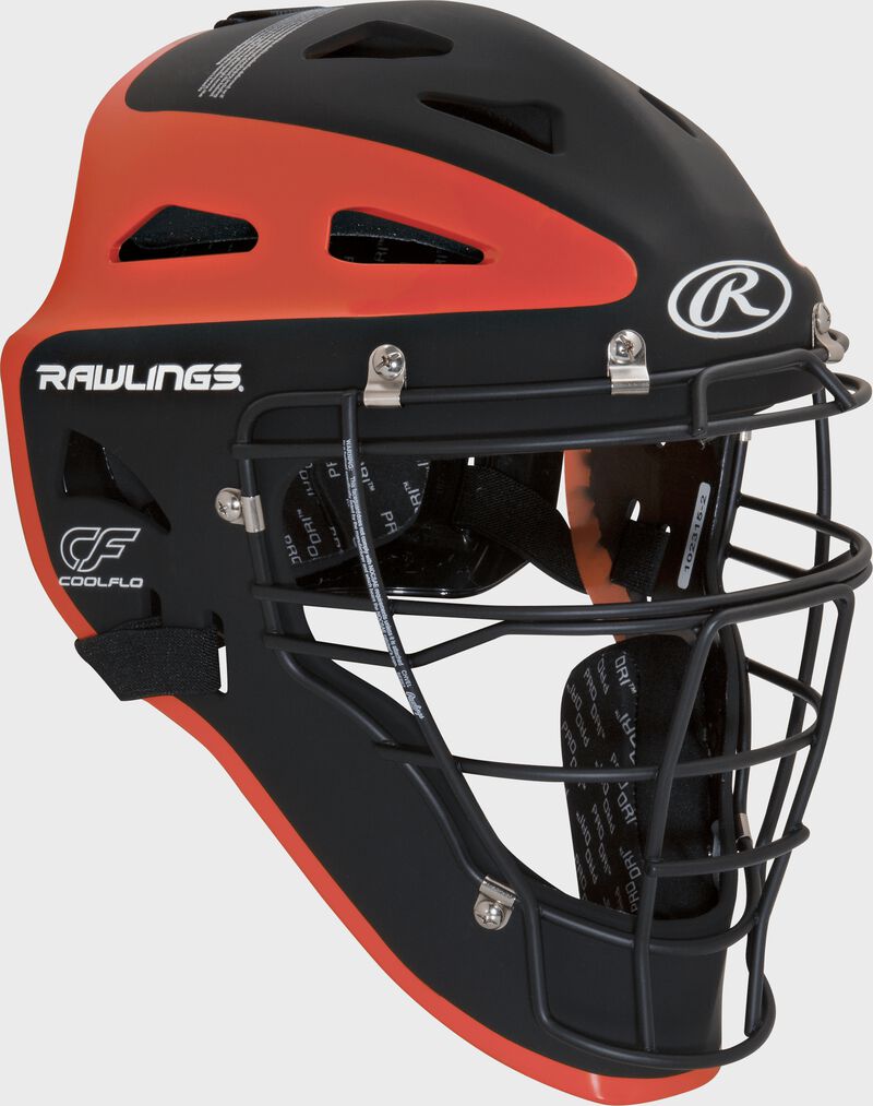 Front right of a black/orange CHVELY Rawlings Velo catcher's helmet