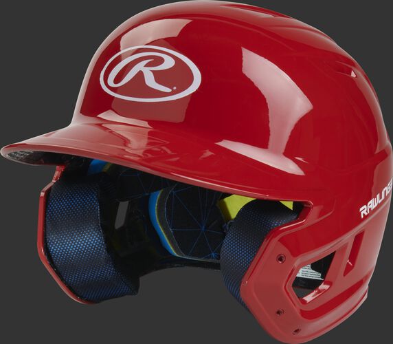 Left angle view of a Rawlings MACH Junior helmet with a one-tone matte scarlet shell