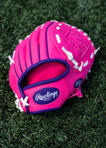 Purple Rawlings logo on a pink Rawlings Players Series glove lying on a field - SKU: PL91PP
