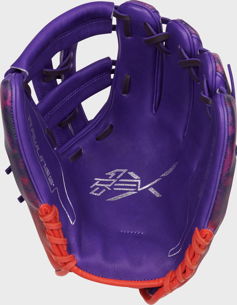 Purple palm of a Rawlings Francisco Lindor REV1X glove with navy laces