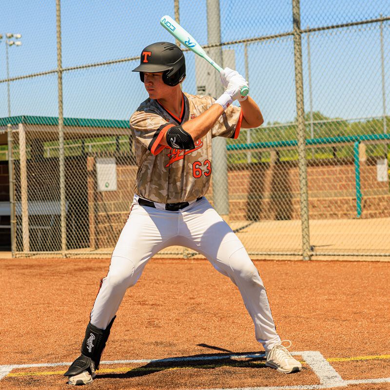 Picture of a player in his batting stance with a 2026 Rawlings Icon BBCOR bat loading=