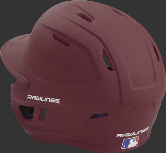 Back left view of a matte maroon MACH series batting helmet with air vents