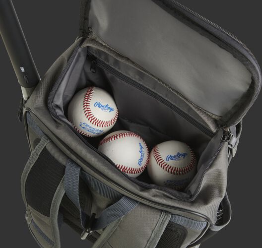 Three baseballs in the top valet tray of a grey R701 training bag