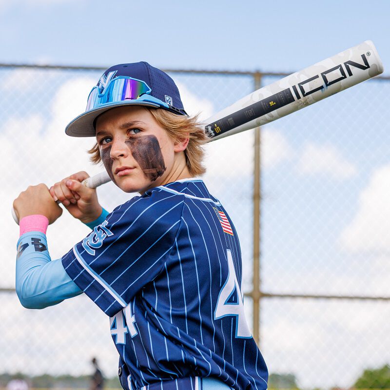 Picture of a player hin his batting stance with a 2025 USSSA Icon bat