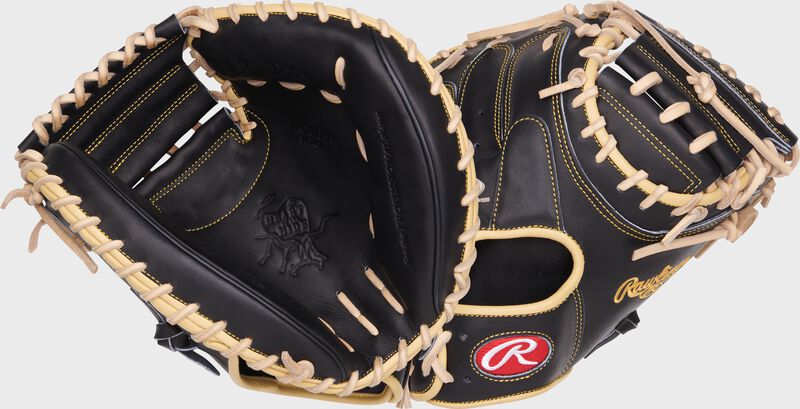Two images showing the palm & back of a black Heart of the Hide Adley Rutschman 34" catcher's mitt