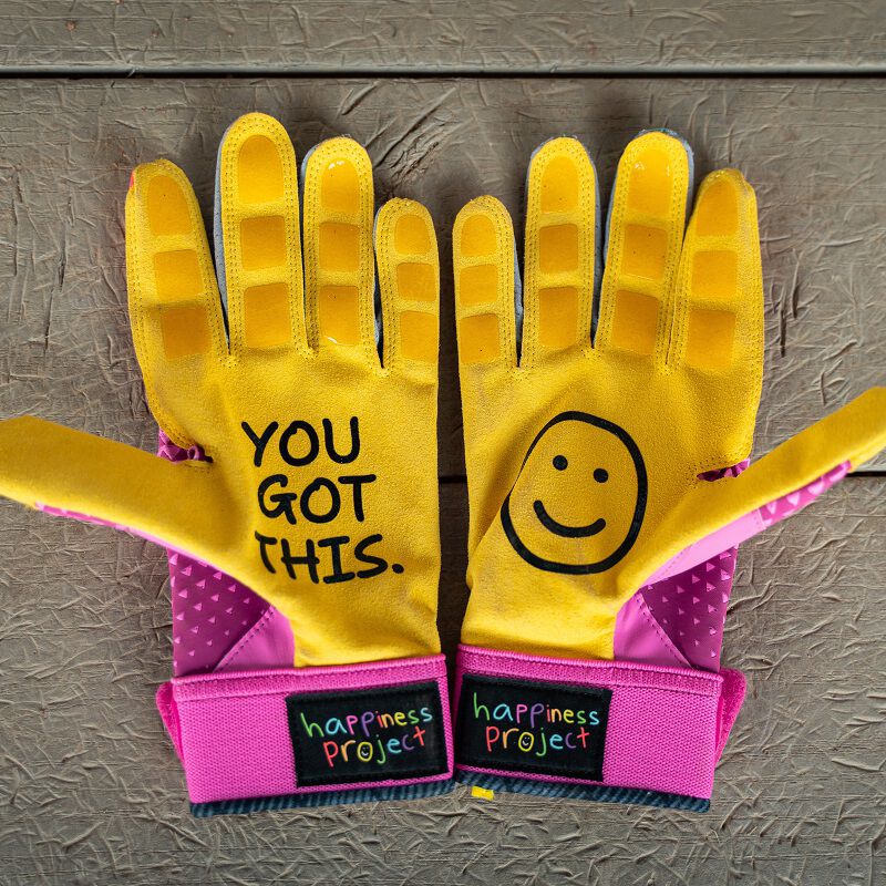 Picture of the yellow palms of a pair of pink Easton x Happiness Project Ghost NX fastpitch batting gloves loading=