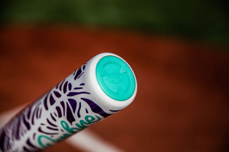 Teal end cap of a Rawlings Ombre -11 bat with a field in the background - SKU: FPZO11 loading=
