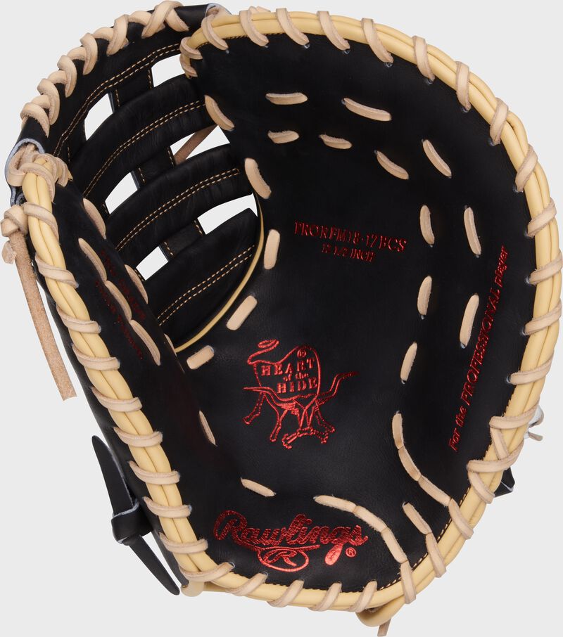 Black palm of a Rawlings Heart of the Hide first base mitt with red stamping and camel laces