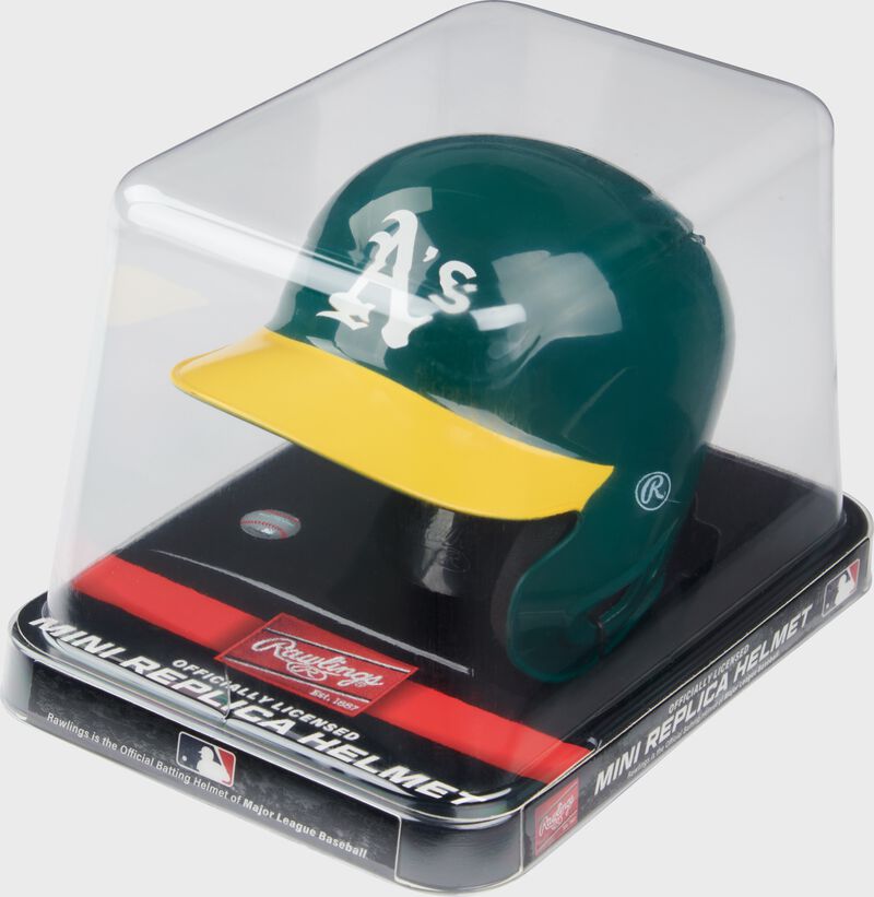 A green/yellow Oakland A's mini replica helmet in a clear packaging case