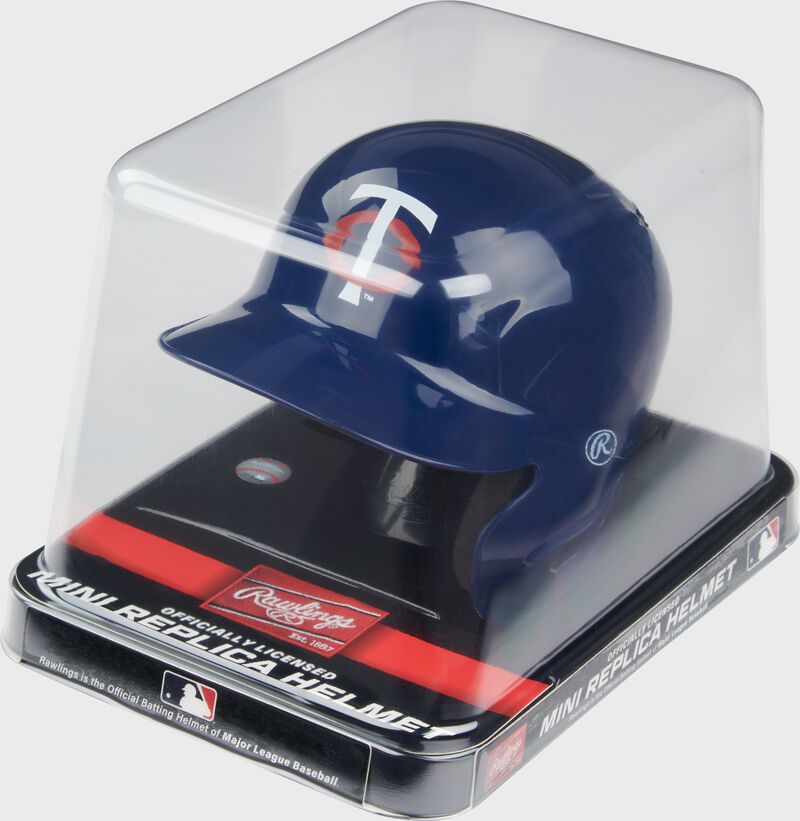 A navy Minnesota Twins mini helmet in a clear packaging case