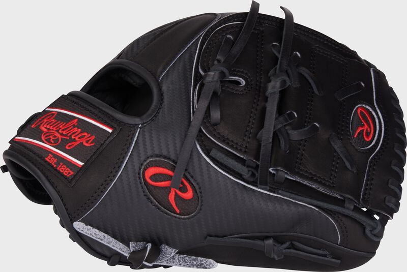 Thumb of a black Heart of the Hide Hyper Shell infield/pitcher's glove with a black 2-piece solid web