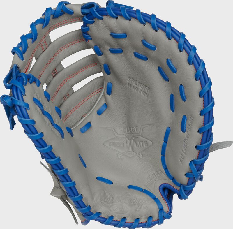 Gray palm of a Rawlings Freddie Freeman Select Pro Lite First Base Mitt with royal laces